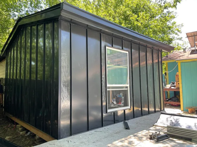 Black standing seam metal wall panels for Roof Inspection in Nibley