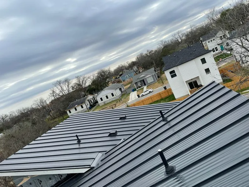 Standing seam metal roof panels with vents for Skylight Repair in Nibley